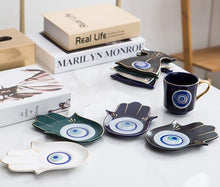 Load image into Gallery viewer, Evil Eye, Hamsa Hand and Mermaid's Tail themed Cup and Saucer Sets - Cup and Saucer SetWhiteCircular DesignHamsa Hand