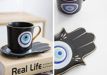 Load image into Gallery viewer, Evil Eye, Hamsa Hand and Mermaid's Tail themed Cup and Saucer Sets - Cup and Saucer SetWhiteCircular DesignHamsa Hand