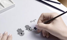 Load image into Gallery viewer, Evil Eye with Hamsa Hand Silver Stud Earrings - Earrings
