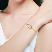 Load image into Gallery viewer, Image of a lady wearing an eye shaped women Evil Eye necklace silver in a beautiful and delicate, blue and white stone-studded eye-shaped Evil Eye
