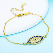 Load image into Gallery viewer, Image of a gold Evil Eye necklace in a beautiful and delicate, blue and white stone-studded eye-shaped Evil Eye