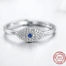 Load image into Gallery viewer, Image of white Evil Eye ring silver in a sparkling blue and white stone-studded eye-shaped Evil Eye