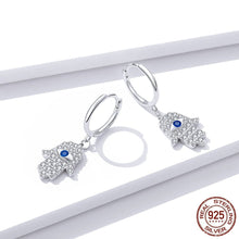Load image into Gallery viewer, White Stone Hamsa Hand with Evil Eye Silver Drop Earrings - Earrings