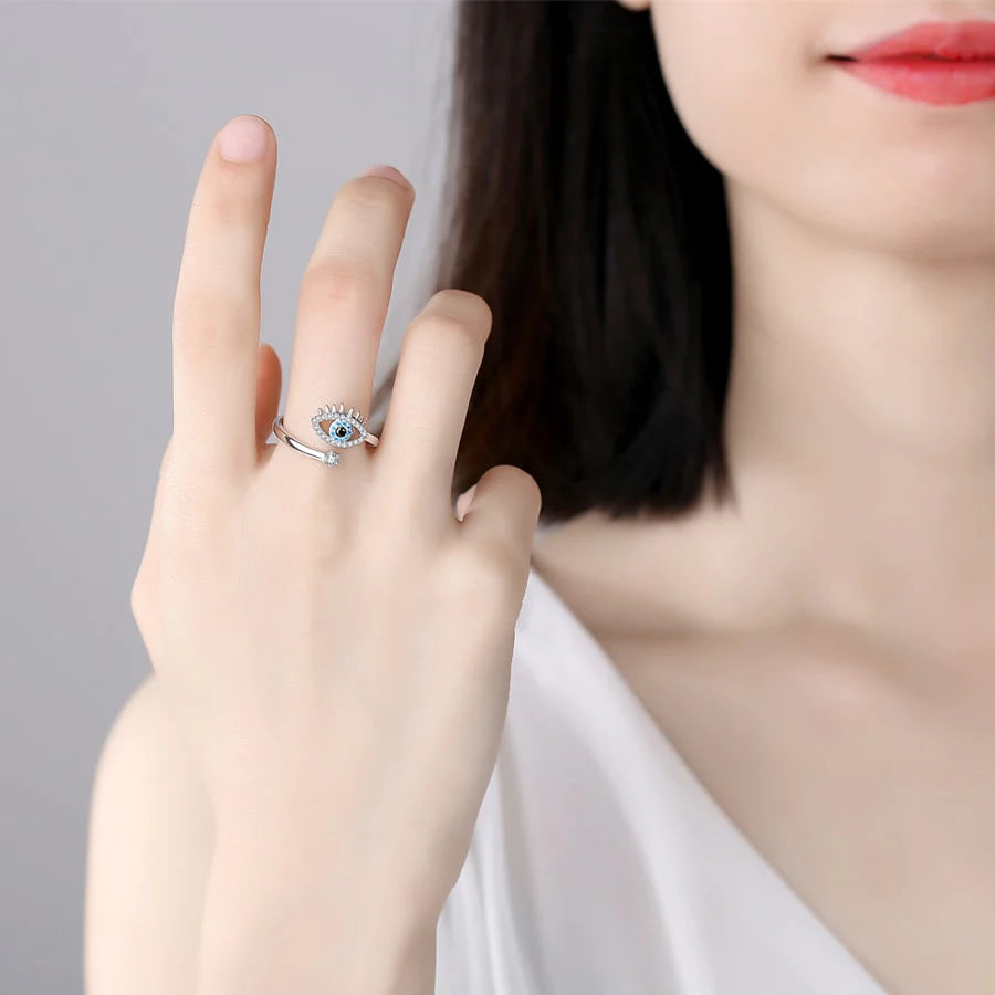 Image of a lady wearing an evil eye ring