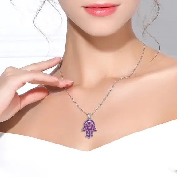 Image of a lady wearing a Hamsa pendant