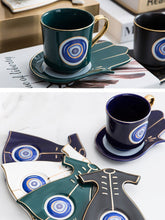 Load image into Gallery viewer, Evil Eye, Hamsa Hand and Mermaid&#39;s Tail themed Cup and Saucer Sets - Cup and Saucer SetGreenEye DesignMermaid&#39;s Tail
