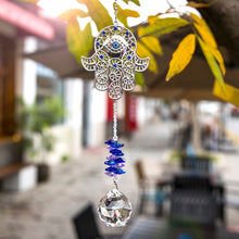 Load image into Gallery viewer, Hamsa Hand with Evil Eye Wall Hanging with Single Large Suncatcher Crystal - Wall Hanging
